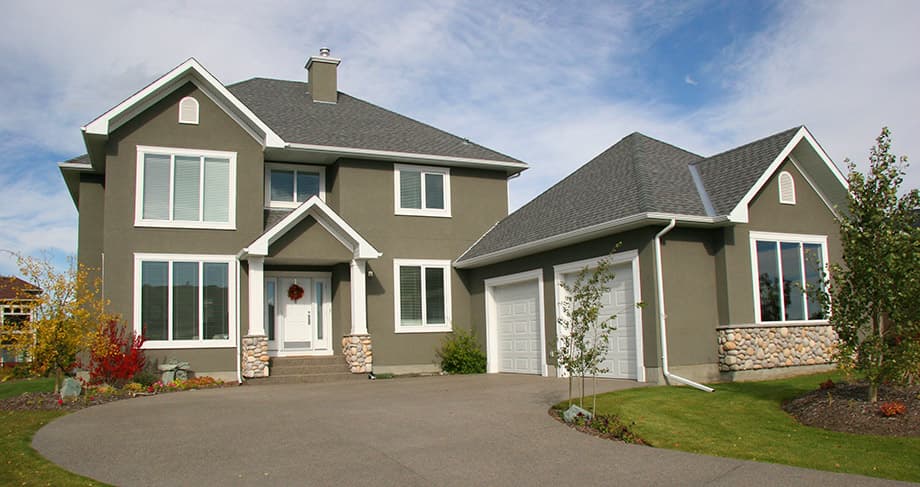 Exterior shot of a large house from the driveway